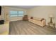 Bright living room featuring a large window with scenic views and classic furnishings at 1270 Gulf Blvd # 506, Clearwater Beach, FL 33767