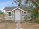 Exterior view of home's front entrance, shows the facade and walkway at 1679 29Th N Ave, St Petersburg, FL 33713