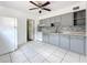 Bright kitchen with white appliances, gray cabinets, and tile backsplash at 1679 29Th N Ave, St Petersburg, FL 33713