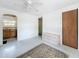 Bright living room with a view into the kitchen, a ceiling fan, and a closet at 1679 29Th N Ave, St Petersburg, FL 33713