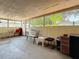 Enclosed patio area featuring outdoor seating, screened openings, and a relaxing atmosphere at 1679 29Th N Ave, St Petersburg, FL 33713