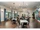 Bright clubhouse dining area with contemporary decor and wood floors at 16969 Falling Waters Ct, Land O Lakes, FL 34638