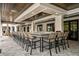 Stunning outdoor bar featuring a tile front, comfortable seating, and a beautiful wood ceiling at 16969 Falling Waters Ct, Land O Lakes, FL 34638