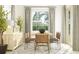 Dining room with a wooden table, chairs, a buffet, and large window providing natural light at 16969 Falling Waters Ct, Land O Lakes, FL 34638
