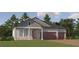Charming single-Gathering home with a two-car garage, a welcoming front porch, and a well-manicured lawn at 16969 Falling Waters Ct, Land O Lakes, FL 34638