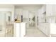 Open-concept kitchen featuring a large island with seating and stainless-steel appliances and a large window at 16969 Falling Waters Ct, Land O Lakes, FL 34638