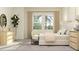 Stylish bedroom with a king-size bed, designer furnishings, and large windows for natural light at 16969 Falling Waters Ct, Land O Lakes, FL 34638