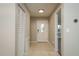 Inviting entryway with neutral paint and tile flooring leading into the house at 1721 Sutton Pl, Dunedin, FL 34698