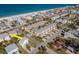 Aerial view showcasing a beach neighborhood with houses, condos, and close proximity to the ocean at 1812 1St St, Indian Rocks Beach, FL 33785