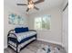 Inviting bedroom with a trundle bed, natural light, and simple, stylish decor at 1812 1St St, Indian Rocks Beach, FL 33785