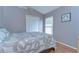 Cozy bedroom with neutral decor, double bed, closet and window at 1915 Fellsway Ct, Wesley Chapel, FL 33543