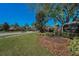 Elegant community entrance sign with stone pillars and landscaping, creating a welcoming atmosphere at 19719 Prince Benjamin Dr, Lutz, FL 33549