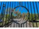 Gated community entrance with ornate metalwork, offering security and exclusivity to residents at 19719 Prince Benjamin Dr, Lutz, FL 33549
