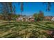 Charming home with stone accents, manicured lawn, and mature trees creating curb appeal at 19719 Prince Benjamin Dr, Lutz, FL 33549