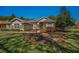Well-maintained home exterior with stone accents, lush landscaping, and a charming curb appeal at 19719 Prince Benjamin Dr, Lutz, FL 33549