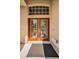 Inviting front door with decorative glass inserts and a stylish welcome mat at 19719 Prince Benjamin Dr, Lutz, FL 33549