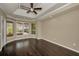 The primary bedroom includes hardwood floors and a bay window for natural light at 19719 Prince Benjamin Dr, Lutz, FL 33549