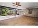Covered patio features brick pavers, ceiling fans, and ample space for outdoor entertaining, offering a relaxing retreat at 19719 Prince Benjamin Dr, Lutz, FL 33549