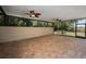Large covered patio with brick pavers and screens, ideal for enjoying the outdoors in comfort, and outdoor entertaining at 19719 Prince Benjamin Dr, Lutz, FL 33549
