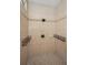 Inside the tiled shower in the primary bathroom with multiple shower heads at 19719 Prince Benjamin Dr, Lutz, FL 33549
