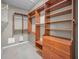 Spacious walk-in closet with custom built-in shelves and drawers for ample storage at 19719 Prince Benjamin Dr, Lutz, FL 33549