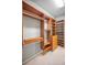 Well-organized walk-in closet featuring custom shelving and drawers for optimized storage solutions at 19719 Prince Benjamin Dr, Lutz, FL 33549