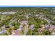 See the residential neighborhood in this aerial view, showcasing tree-lined streets and nearby homes at 2340 Kingston S St, St Petersburg, FL 33711