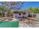 Backyard showcasing a home with a grill on the porch at 2340 Kingston S St, St Petersburg, FL 33711