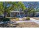 Charming home with front porch, featuring well-maintained landscaping and a welcoming facade at 2340 Kingston S St, St Petersburg, FL 33711