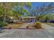 Charming one-story house with a inviting front porch and well-maintained lawn at 2340 Kingston S St, St Petersburg, FL 33711