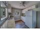 A kitchen featuring modern appliances, bright cabinets, and hardwood floors at 2340 Kingston S St, St Petersburg, FL 33711