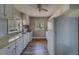 A bright kitchen featuring stainless steel appliances, bright cabinets, and hardwood floors at 2340 Kingston S St, St Petersburg, FL 33711