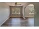Bright living room with hardwood floors, ceiling fan, and natural light at 2340 Kingston S St, St Petersburg, FL 33711