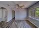 Open-concept living room with new light-colored wood-look floors and plenty of natural light at 2340 Kingston S St, St Petersburg, FL 33711