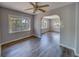 Bright living room featuring hardwood floors, ceiling fan, and natural light at 2340 Kingston S St, St Petersburg, FL 33711