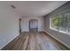 Spacious living room boasting light-colored wood-look flooring, neutral paint and arched doorways at 2340 Kingston S St, St Petersburg, FL 33711