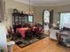 Formal dining room featuring hardwood floors and plenty of seating around the table at 2405 Clubhouse Dr, Plant City, FL 33566