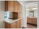 Bathroom with wood cabinetry and granite countertops at 2600 W Vina Del Mar Blvd, St Pete Beach, FL 33706