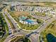 Aerial view of community pool, recreational area, and well-planned neighborhood at 3097 Storybrook Preserve Dr, Odessa, FL 33556