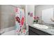 Adorable bathroom featuring donut themed shower curtain and toilet seat with granite vanity at 3097 Storybrook Preserve Dr, Odessa, FL 33556