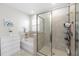 Bright bathroom featuring tub, shower, tile surround, and white dresser for ample storage at 3097 Storybrook Preserve Dr, Odessa, FL 33556