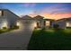 Charming single-story home featuring a well-manicured lawn, a two-car garage, and beautiful stone accents at 3097 Storybrook Preserve Dr, Odessa, FL 33556
