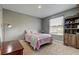 Well-lit bedroom featuring a cozy bed and modern furnishings at 31707 Holcomb Pass, Wesley Chapel, FL 33543