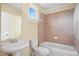 Neutral bathroom featuring a shower and tub combination, and a sink with cabinet at 3405 W Swann Ave # 9, Tampa, FL 33609