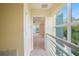Hallway looking into bedroom with large windows bringing in natural light at 3405 W Swann Ave # 9, Tampa, FL 33609