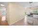 Bright living room featuring tile floors, a breakfast bar, and access to the outside balcony at 3405 W Swann Ave # 9, Tampa, FL 33609