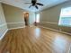 Spacious bedroom featuring wood floors, neutral colors, and ample natural light at 34510 Rose N Dr, Pinellas Park, FL 33781