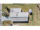 Overhead shot of single-story home, revealing the carport and roof at 37235 Cora Ave, Zephyrhills, FL 33542
