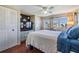 Cozy bedroom featuring a ceiling fan, ample natural light, and closet space at 37235 Cora Ave, Zephyrhills, FL 33542