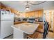 Functional kitchen with stainless steel appliances and a convenient center island with seating at 37235 Cora Ave, Zephyrhills, FL 33542